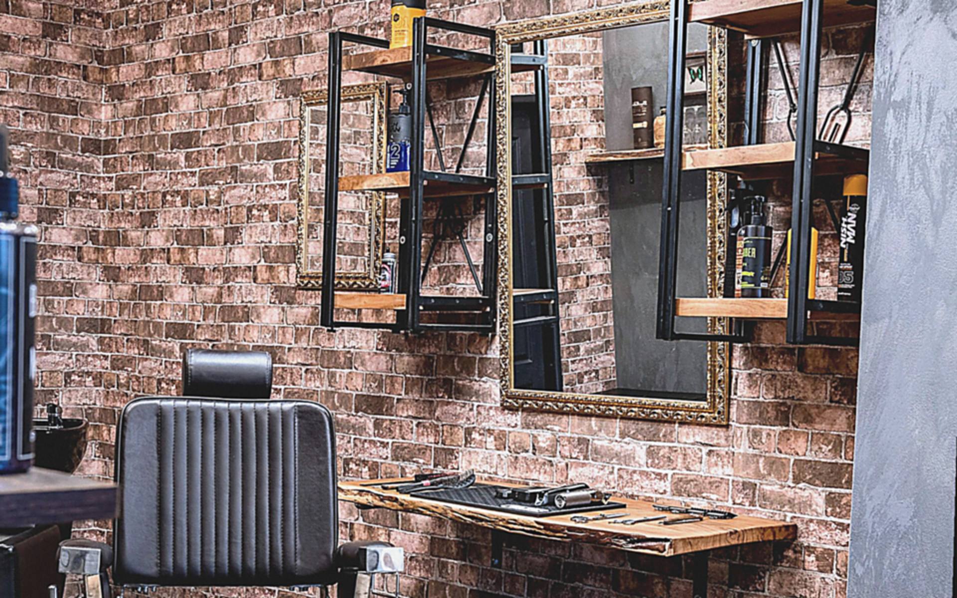 Before: everyday phone snapshot of a barbershop with flat light and an off angle